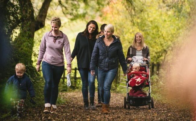 Family enjoy a stroll along one of The Donkey Sanctuary's many scenic trails