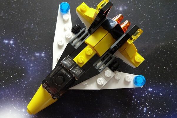 a LEGO spaceship on a starry background