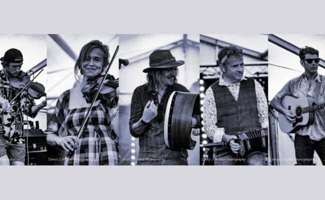 Photograph showing musicians playing instruments