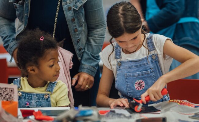 Two children take part in an arts and crafts activity