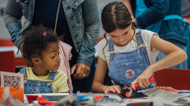 Two children take part in an arts and crafts activity